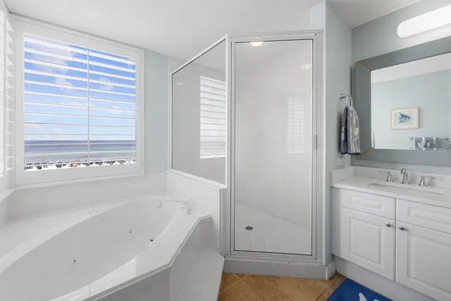 a bathroom with a glass shower door