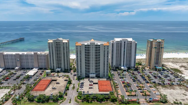 a view of a building with potted plants