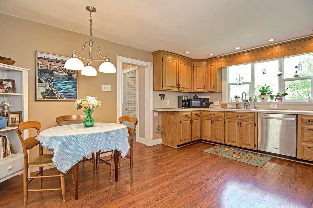 158 Union Street Randolph, MA 02368 - Photo 16 of 41 a kitchen with a table chairs sink and cabinets