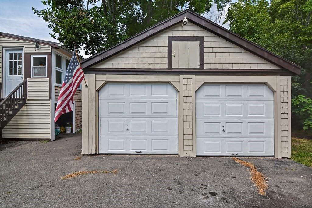 158 Union Street Randolph, MA 02368 - Photo 2 of 41 a view of a house with a outdoor space and garage