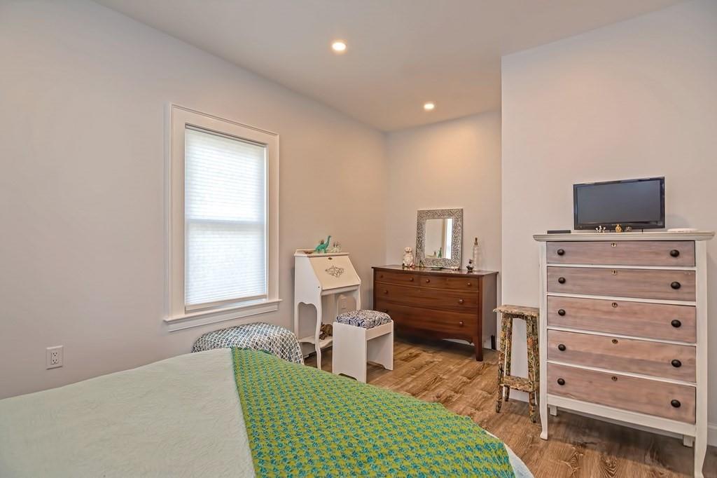 158 Union Street Randolph, MA 02368 - Photo 30 of 41 a living room with furniture and a flat screen tv