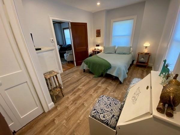 158 Union Street Randolph, MA 02368 - Photo 31 of 41 a bedroom with furniture and a wooden floor