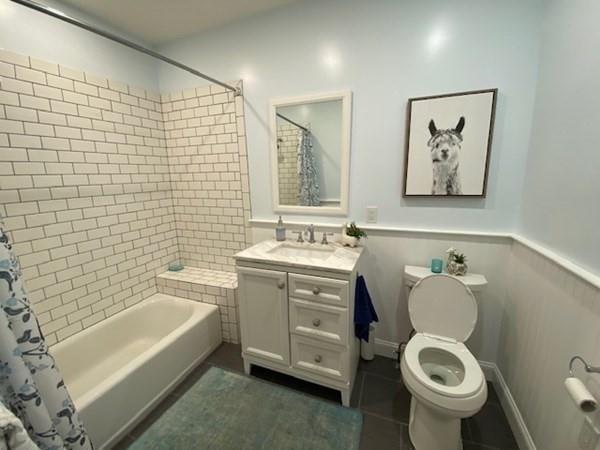 158 Union Street Randolph, MA 02368 - Photo 34 of 41 a bathroom with a toilet sink and mirror