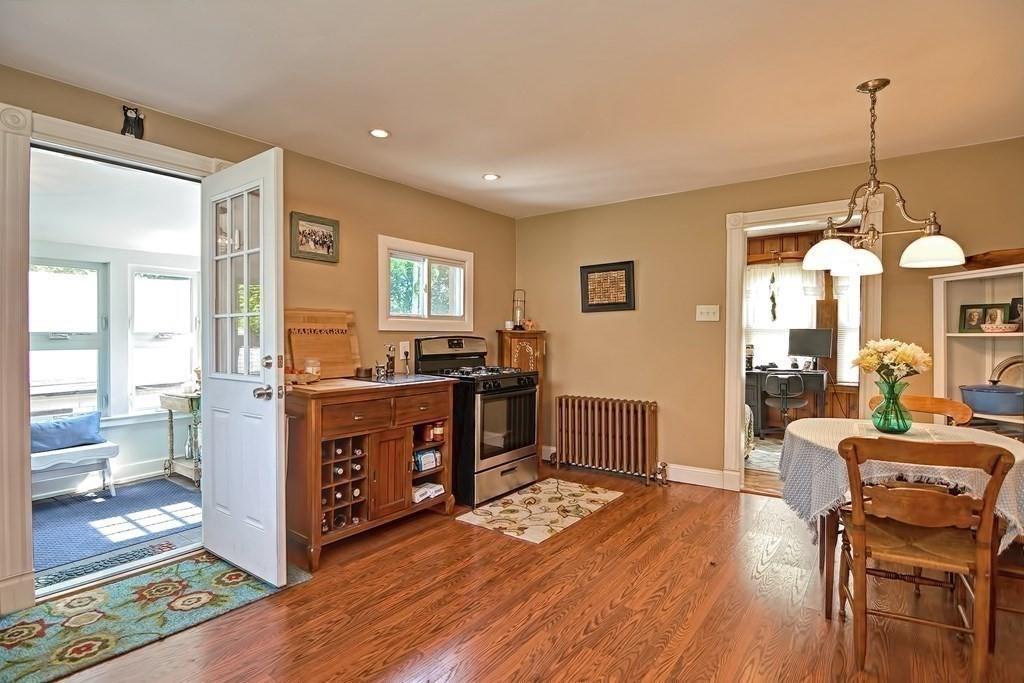 158 Union Street Randolph, MA 02368 - Photo 9 of 41 a large kitchen with lots of counter space and wooden floor
