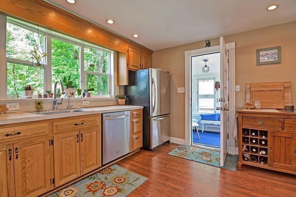 158 Union Street Randolph, MA 02368 - Photo 10 of 41 a kitchen with stainless steel appliances granite countertop a refrigerator and a sink