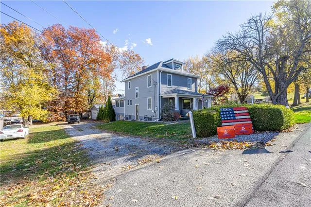a view of a house with a yard