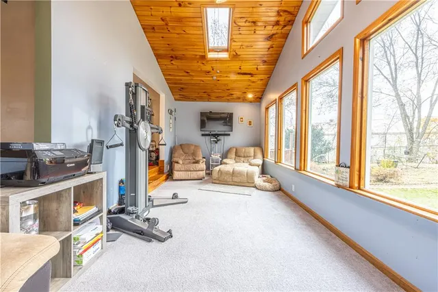 a view of living room with furniture and large windows