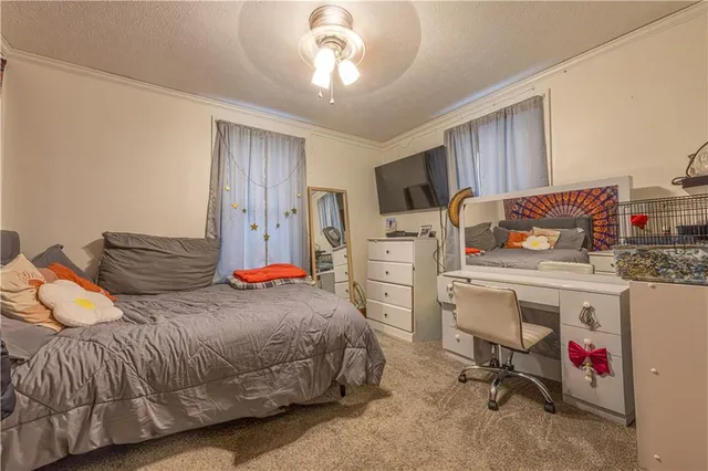 a bedroom with a bed and cabinets