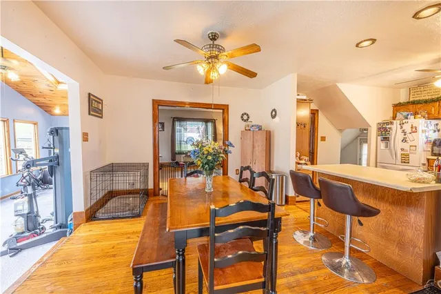 a dining room with furniture and a chandelier