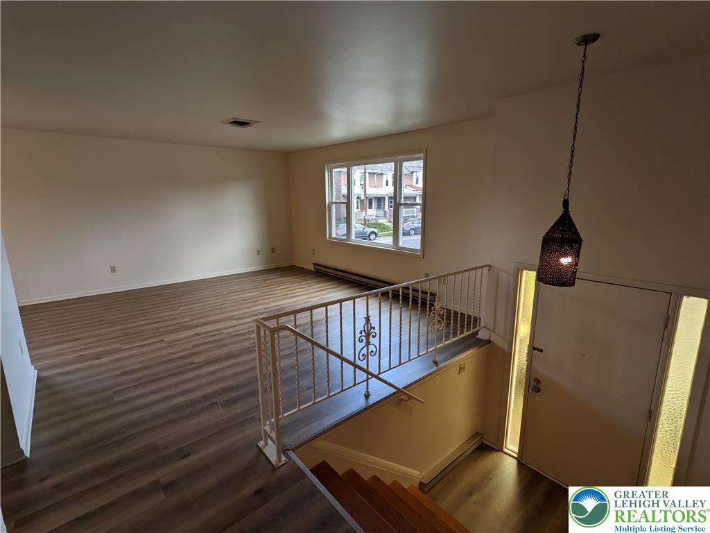 745 Easton Road, Unit 2 Hellertown, PA 18055 - Photo 2 of 12 a view of an empty room with wooden floor
