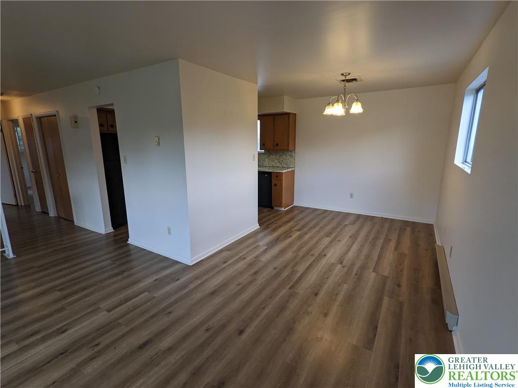 745 Easton Road, Unit 2 Hellertown, PA 18055 - Photo 4 of 12 wooden floor in an empty room with a window