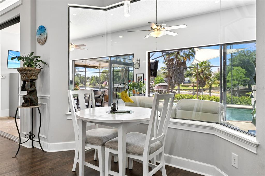11325 Preston Cove Road Clermont, FL 34711 - Photo 17 of 58 a dining room with furniture garden view and a chandelier