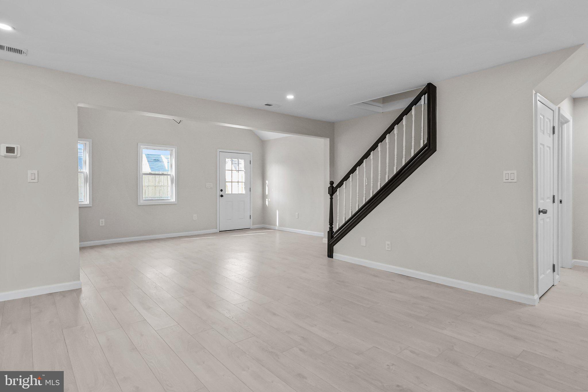 121 Goldengate Road Levittown, PA 19057 - Photo 9 of 32 a view of an empty room with wooden floor and a window
