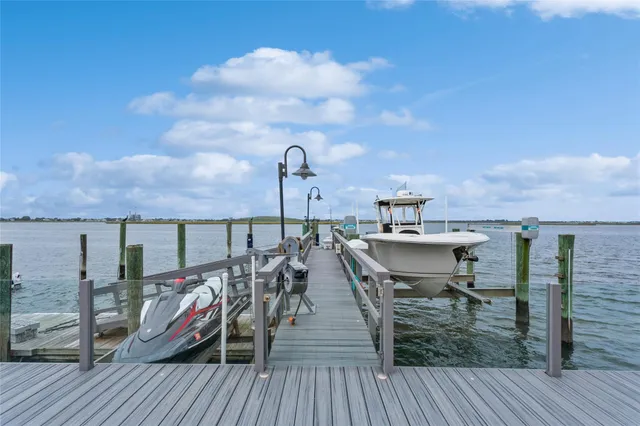a view of a roof deck with two chair and a table