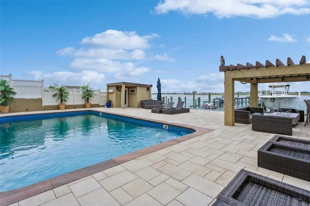 a view of a rooftop deck and living room