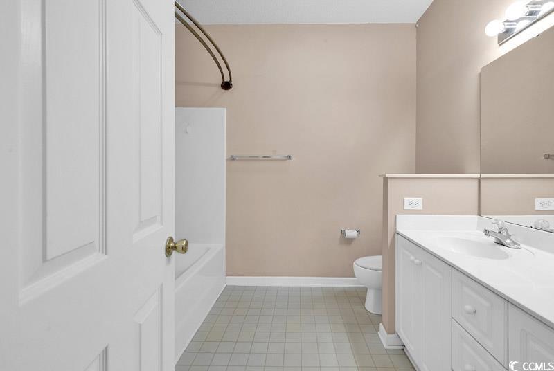 4672 Lightkeepers Way, Unit 50E Little River, SC 29566 - Photo 13 of 19 Full bathroom with vanity, toilet, and bathing tub / shower combination