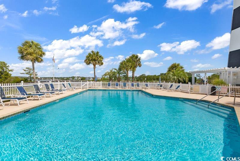 4672 Lightkeepers Way, Unit 50E Little River, SC 29566 - Photo 18 of 19 View of pool featuring a patio area and a pergola