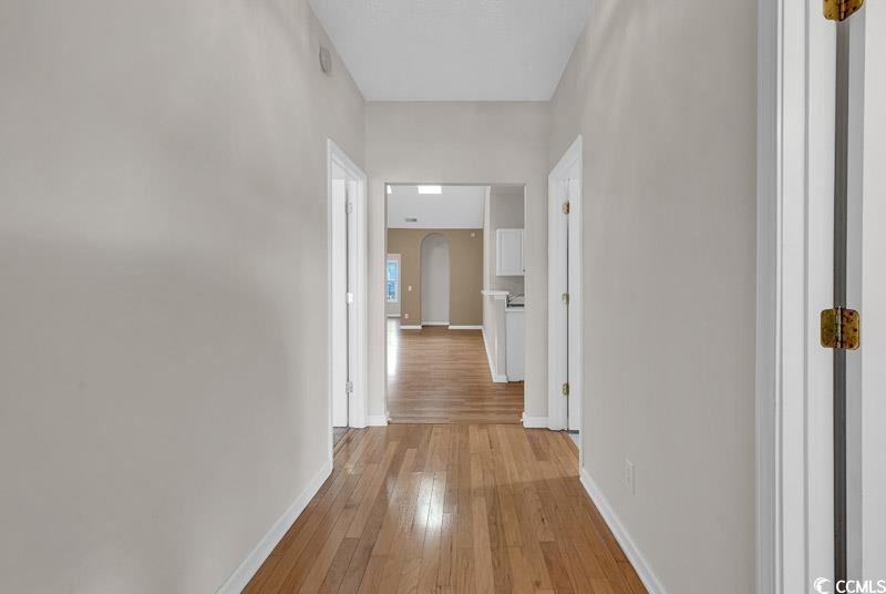 4672 Lightkeepers Way, Unit 50E Little River, SC 29566 - Photo 2 of 19 Hallway with light hardwood / wood-style flooring