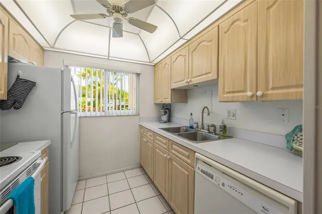 a bedroom with a bed and a potted plant