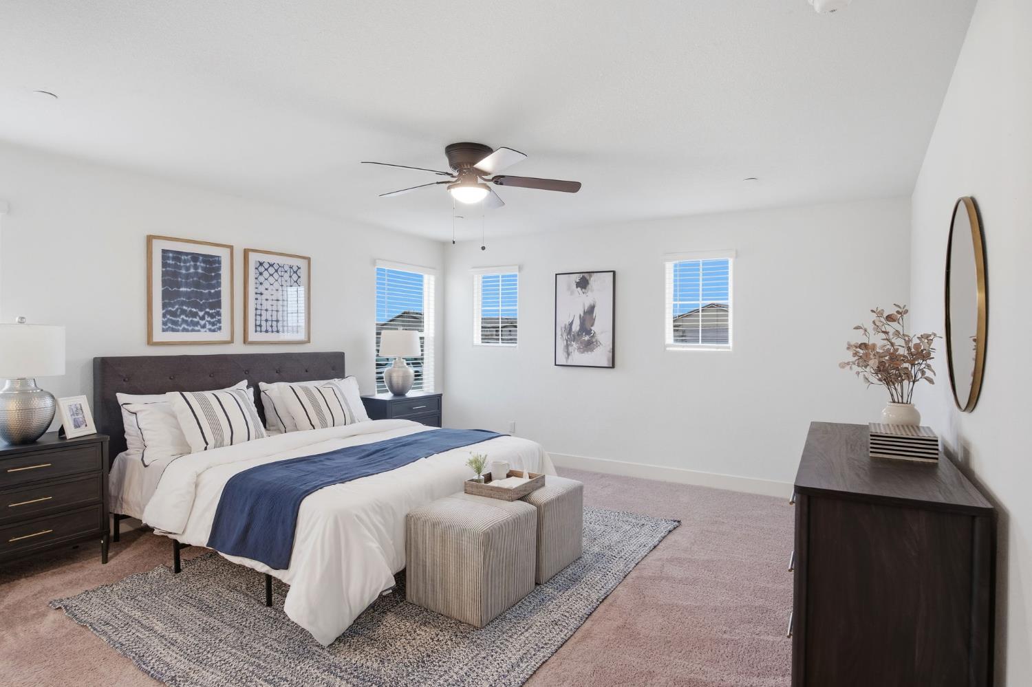 1666 Oak Street Los Banos, CA 93635 - Photo 22 of 34 a spacious bedroom with a bed and a lamp