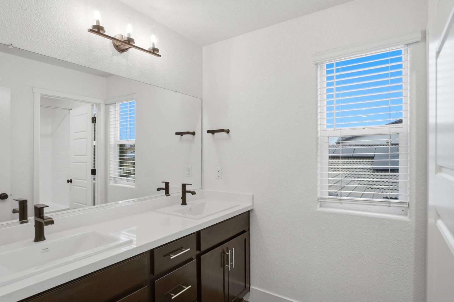 1666 Oak Street Los Banos, CA 93635 - Photo 26 of 34 a bathroom with a sink and a mirror