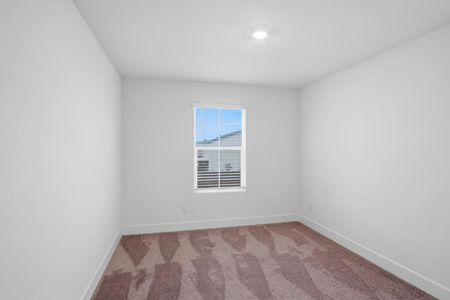 1666 Oak Street Los Banos, CA 93635 - Photo 27 of 34 a view of an empty room with a window