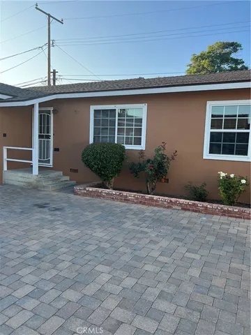 a view of a house with a yard and garage