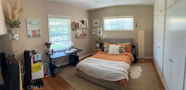 a bedroom with bed and a window