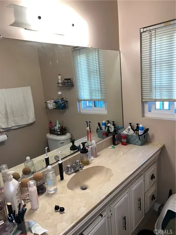 a bathroom with a sink double vanity and a mirror