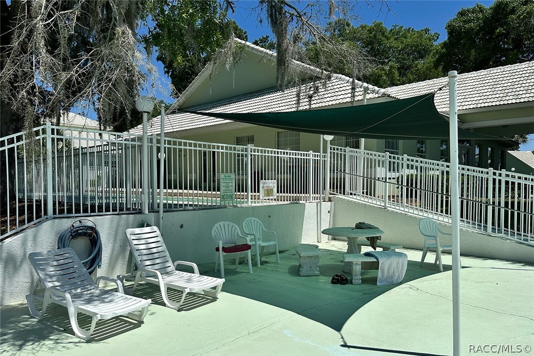 800 Balmoral Court Inverness, FL 34453 - Photo 57 of 72 a balcony with table and chairs