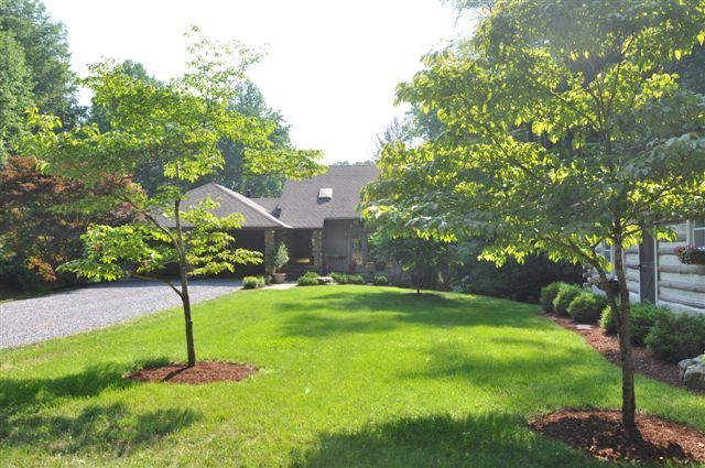 1550 Scout Road Blue Ridge, VA 24064 - Photo 2 of 52 a swimming pool with a yard