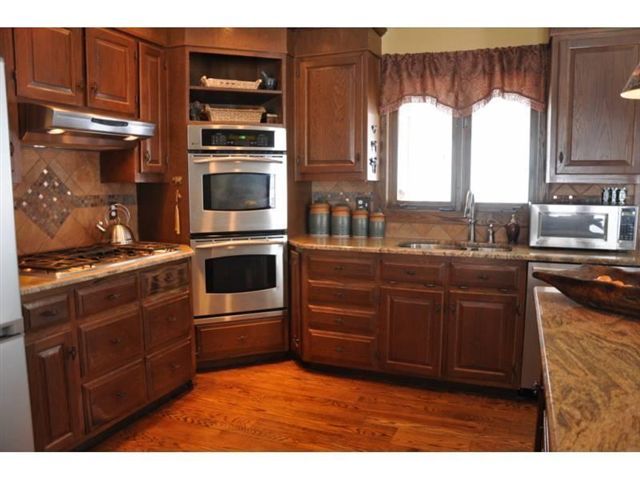 1550 Scout Road Blue Ridge, VA 24064 - Photo 11 of 52 a kitchen with stainless steel appliances granite countertop a stove and a microwave