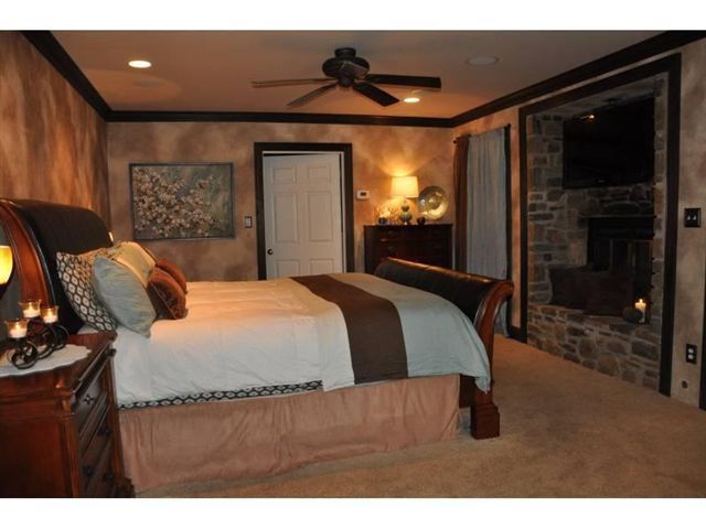 1550 Scout Road Blue Ridge, VA 24064 - Photo 14 of 52 a bedroom with a bed and a mirror