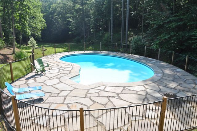 1550 Scout Road Blue Ridge, VA 24064 - Photo 29 of 52 a view of a backyard with a small pool and sitting area