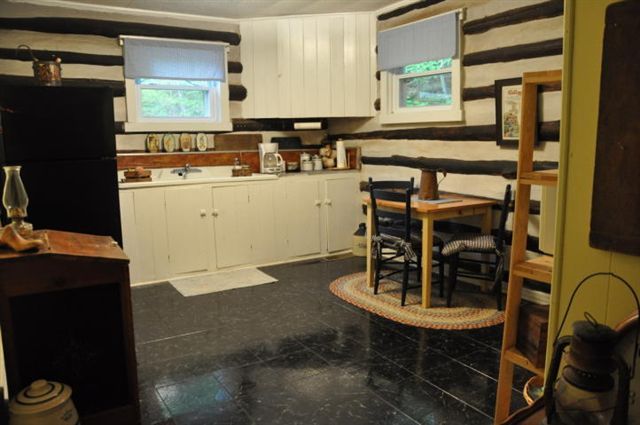 1550 Scout Road Blue Ridge, VA 24064 - Photo 34 of 52 a room with a table chairs and a refrigerator