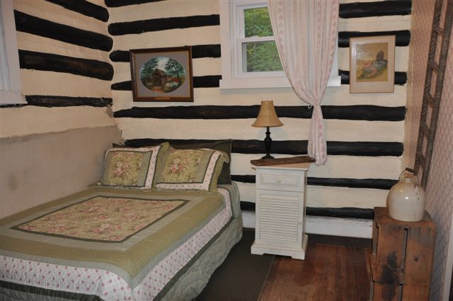1550 Scout Road Blue Ridge, VA 24064 - Photo 37 of 52 a view of a bedroom with bed and wooden floor