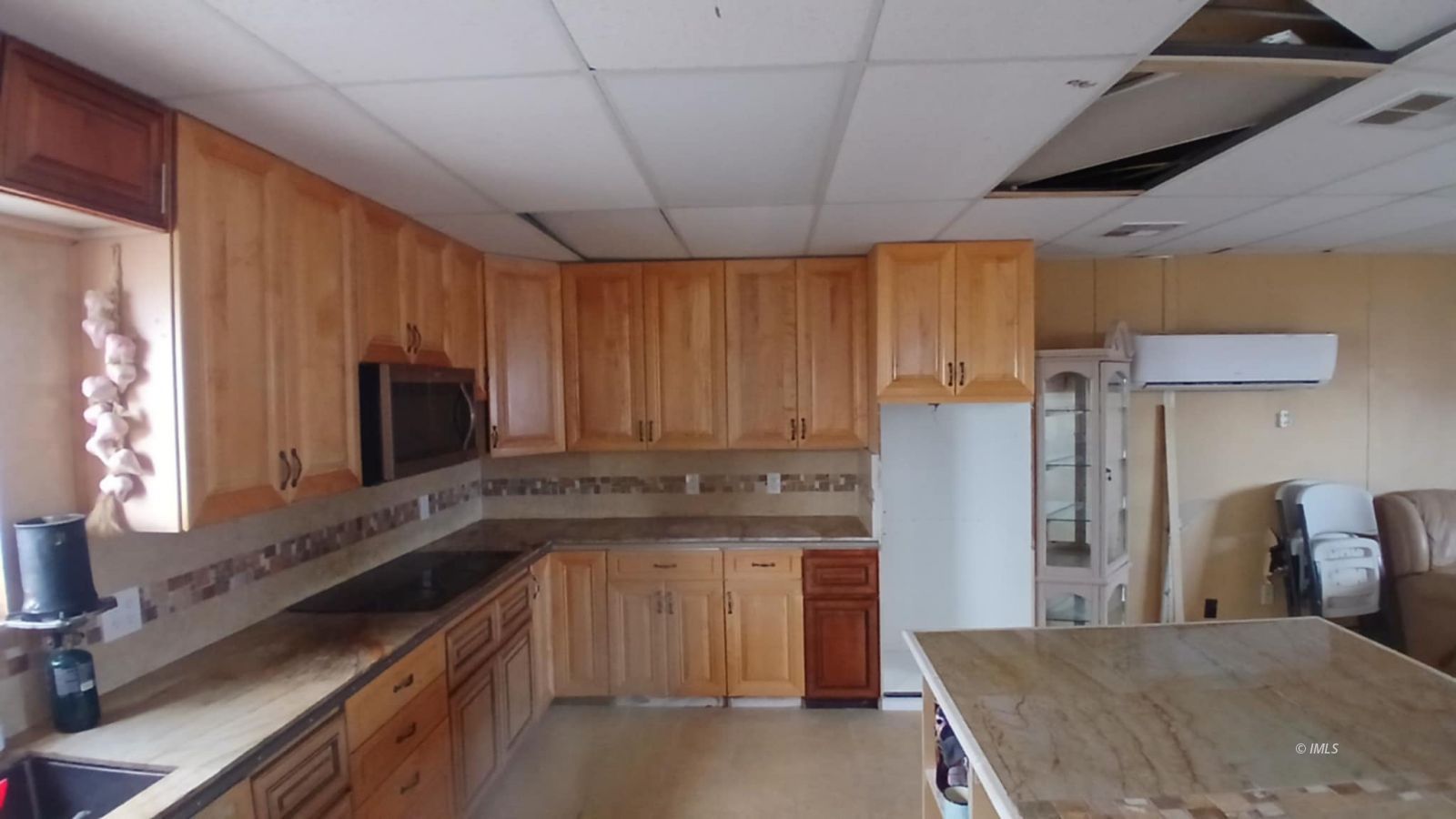 147 Agate Street Tecopa, CA 92389 - Photo 8 of 13 a kitchen with stainless steel appliances granite countertop a refrigerator and a stove top oven