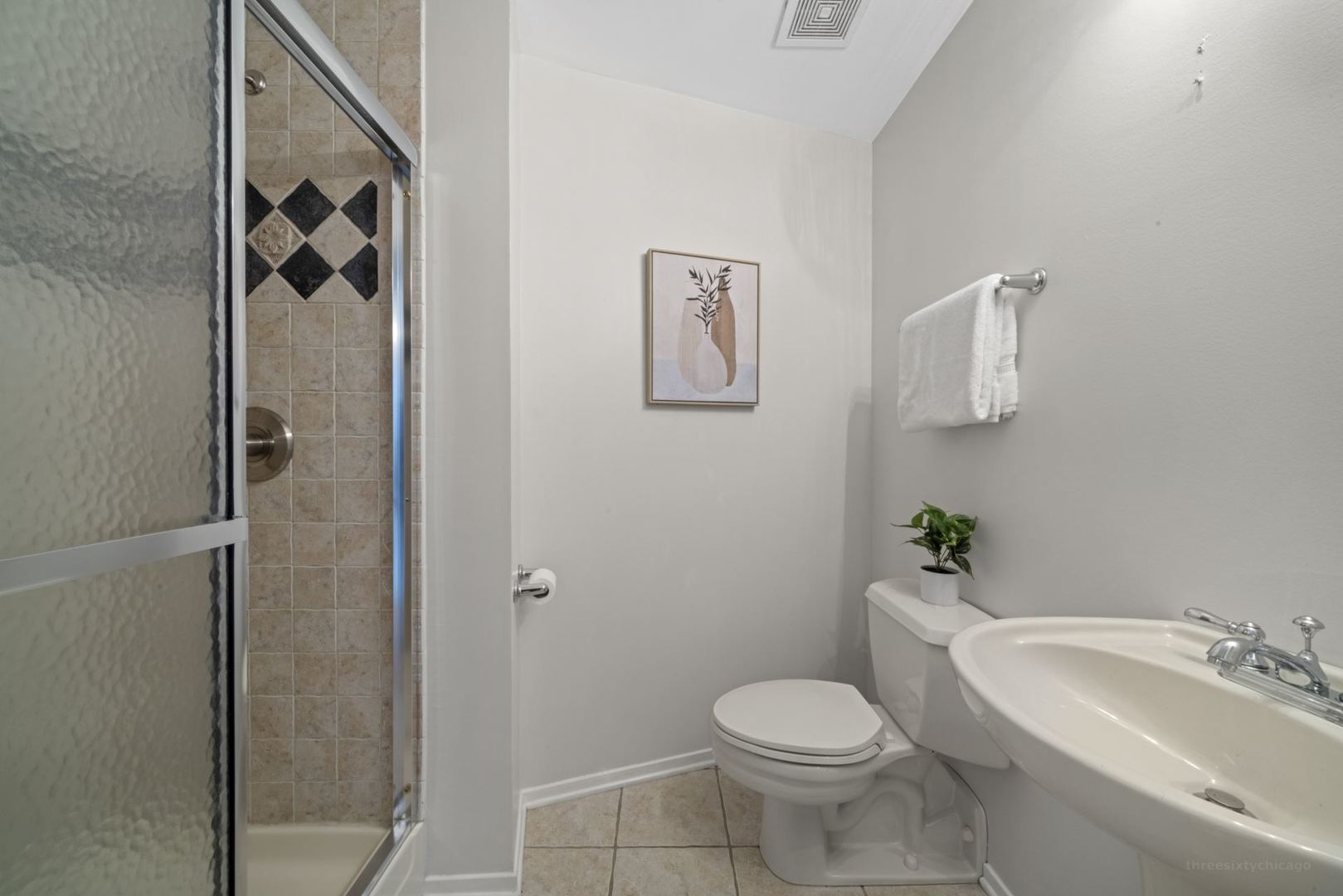1530 South State Street, Unit 607 Chicago, IL 60605 - Photo 22 of 29 a white toilet sitting next to a bathroom sink