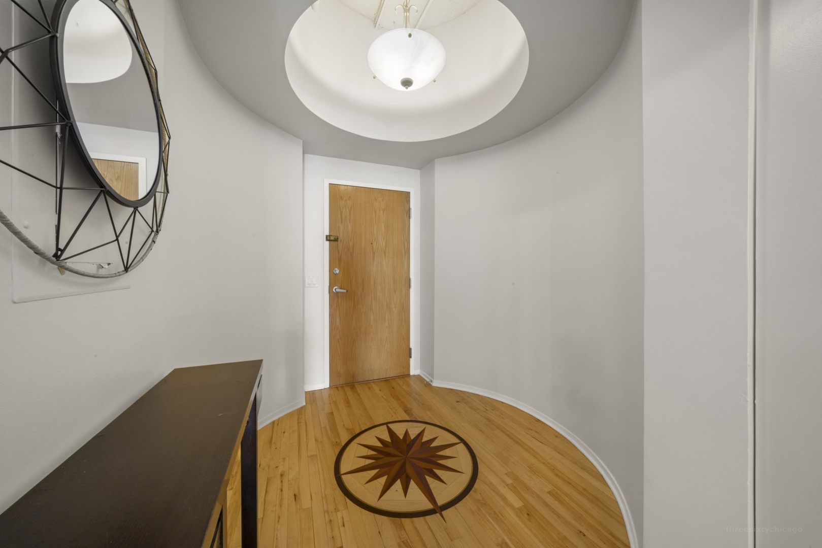 1530 South State Street, Unit 607 Chicago, IL 60605 - Photo 24 of 29 a view of a room with wooden floor and white walls