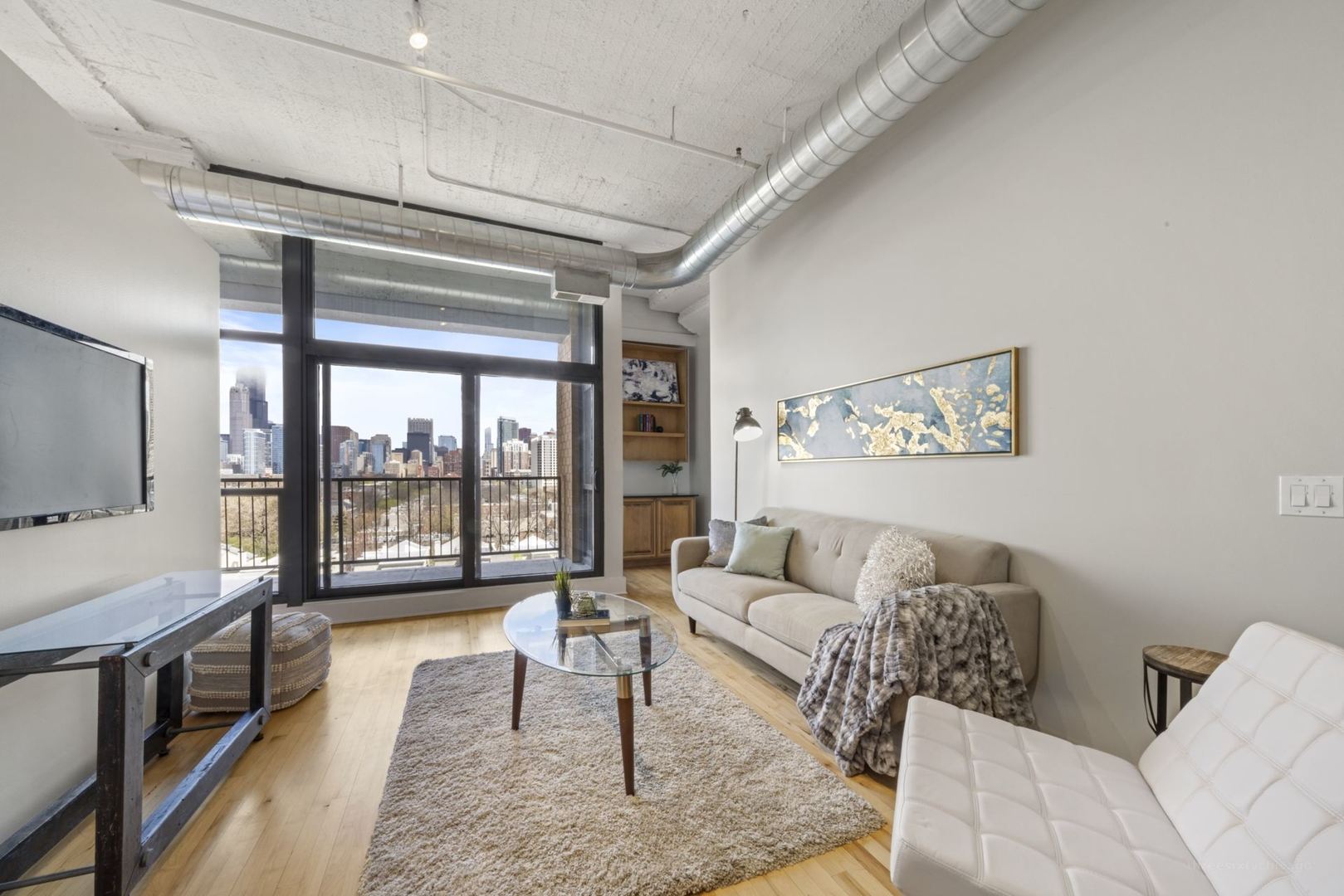 1530 South State Street, Unit 607 Chicago, IL 60605 - Photo 3 of 29 a living room with furniture and a flat screen tv