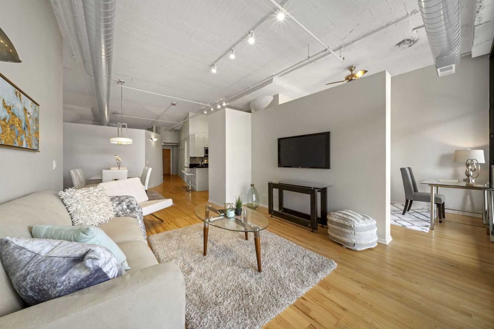 1530 South State Street, Unit 607 Chicago, IL 60605 - Photo 5 of 29 a living room with furniture and a flat screen tv