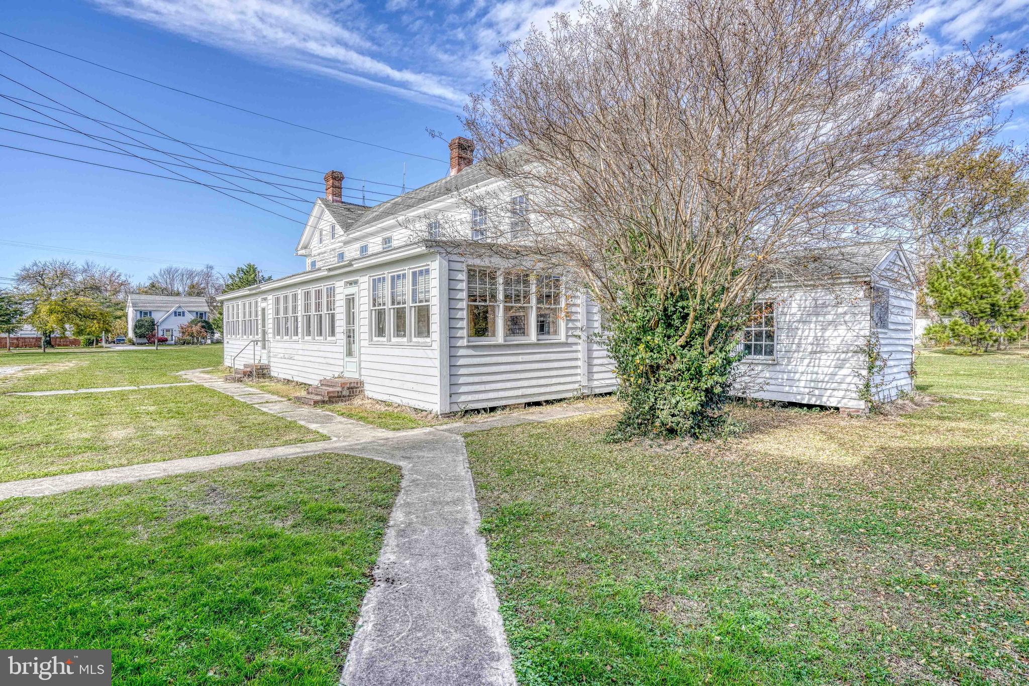 21486 Mission Road Tilghman, MD 21671 - Photo 12 of 32 a view of a house with a yard
