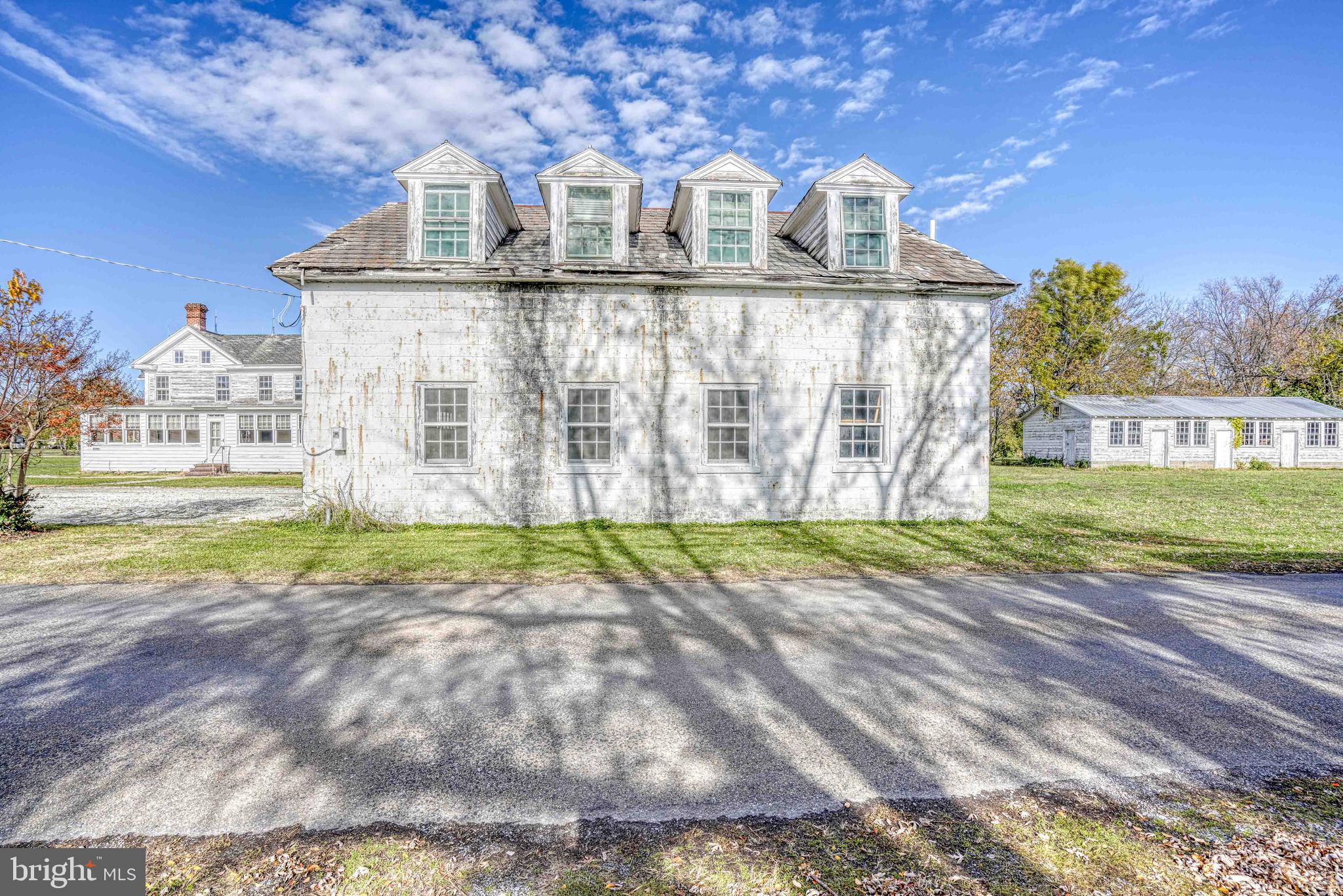 21486 Mission Road Tilghman, MD 21671 - Photo 16 of 32 a view of a street with a building in the background