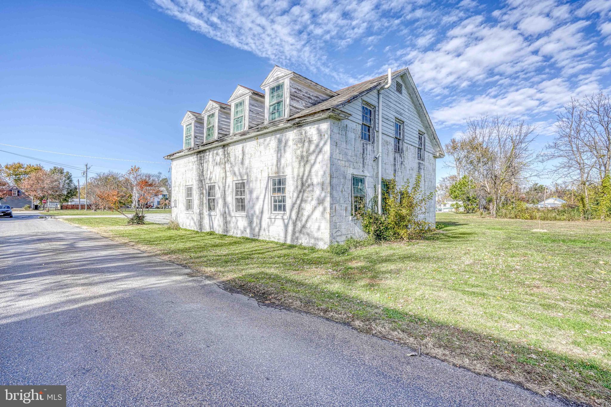 21486 Mission Road Tilghman, MD 21671 - Photo 17 of 32 a view of a house with a yard and pathway