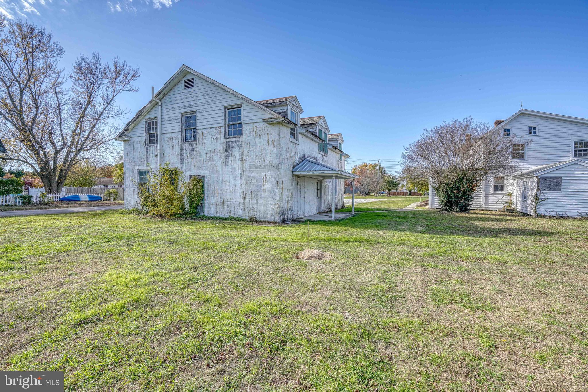 21486 Mission Road Tilghman, MD 21671 - Photo 19 of 32 a view of a house with a yard