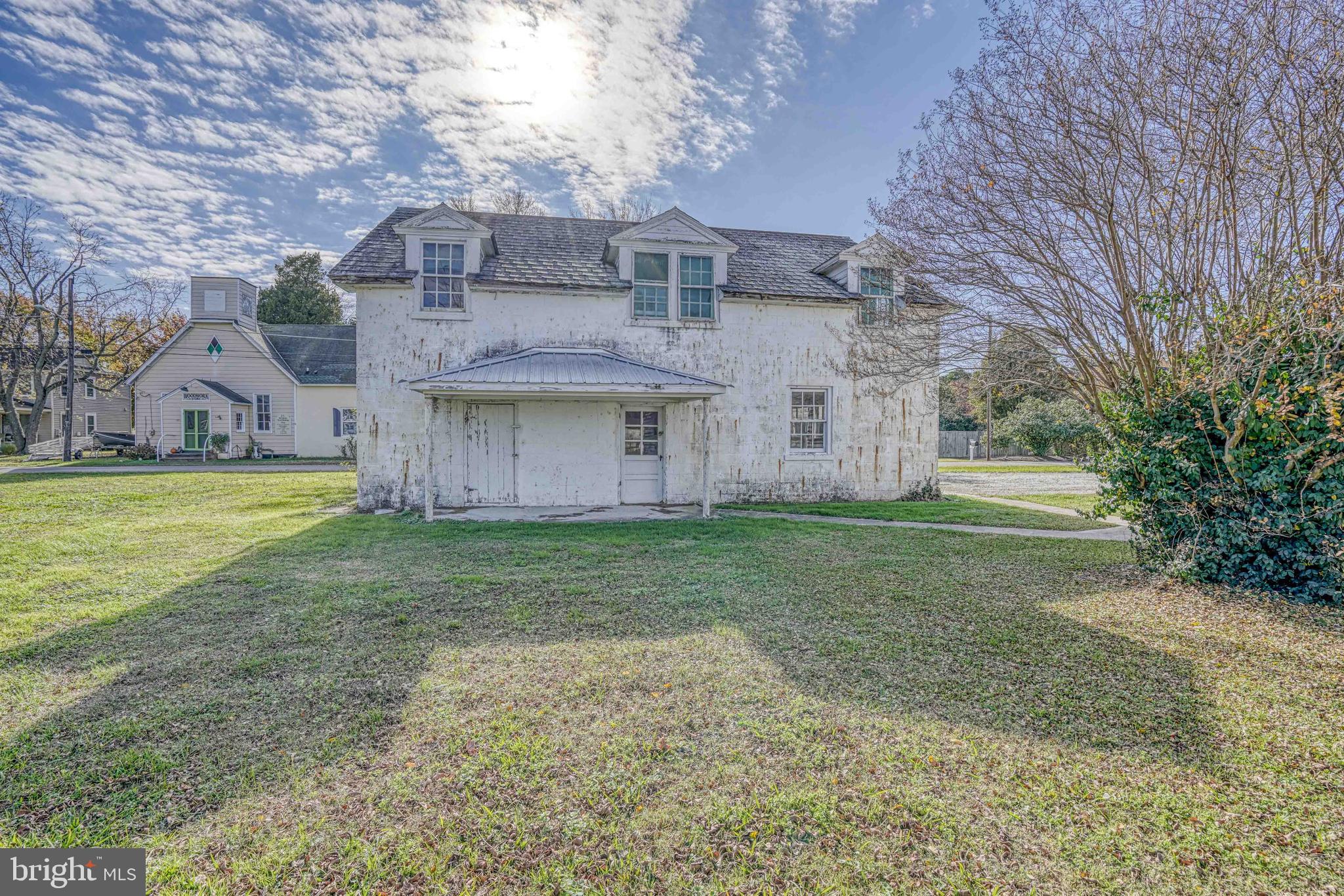21486 Mission Road Tilghman, MD 21671 - Photo 20 of 32 a view of a house with a garden
