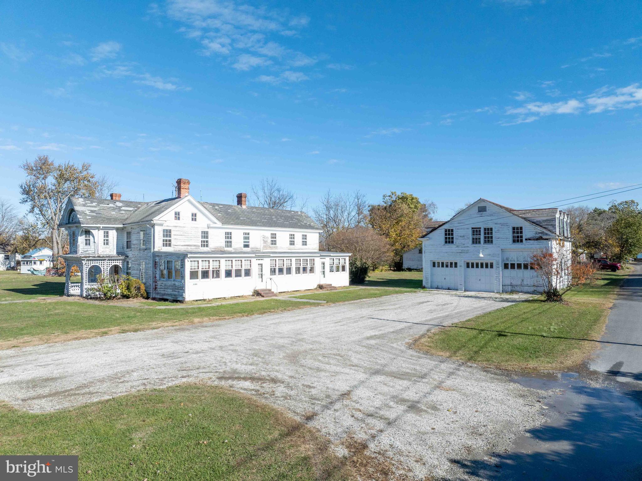 21486 Mission Road Tilghman, MD 21671 - Photo 24 of 32 a view of a big room with a big yard and large trees