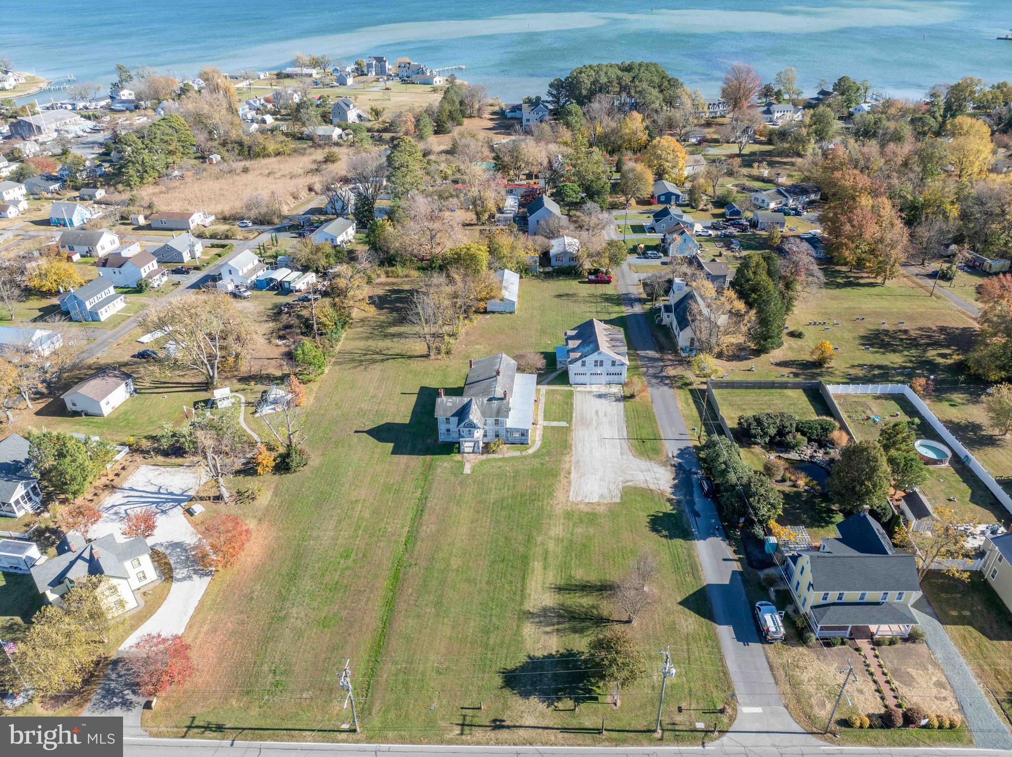 21486 Mission Road Tilghman, MD 21671 - Photo 26 of 32 an aerial view of residential houses with outdoor space