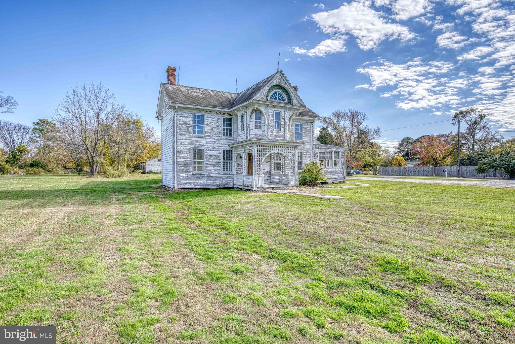 21486 Mission Road Tilghman, MD 21671 - Photo 6 of 32 a front view of a house with garden