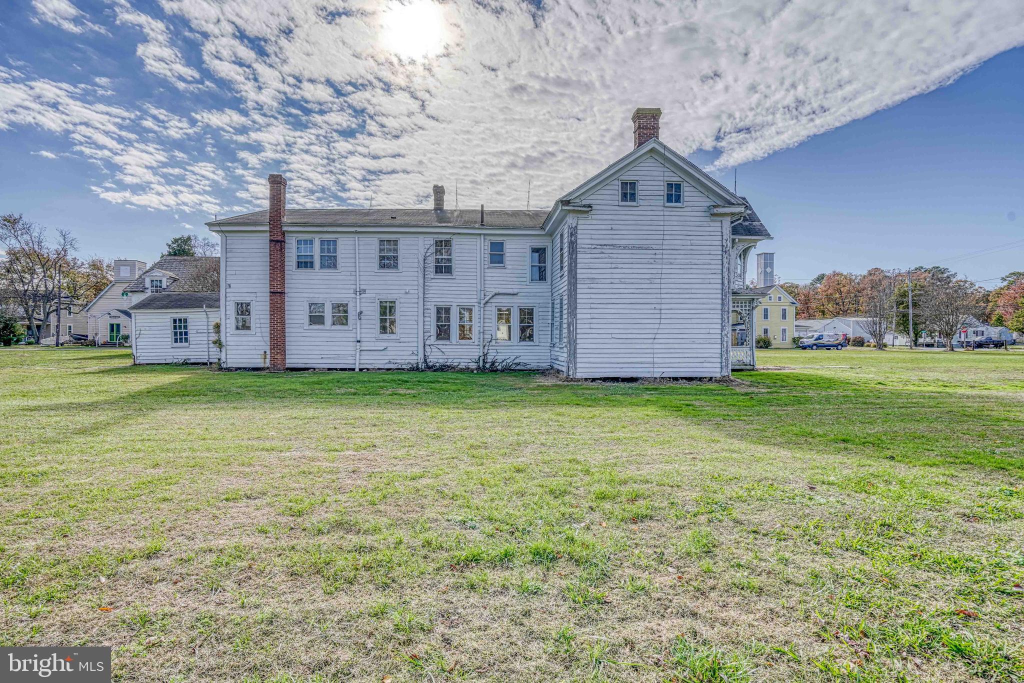21486 Mission Road Tilghman, MD 21671 - Photo 9 of 32 a front view of a house with garden